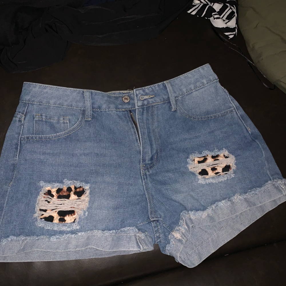 Used blue jean shorts with cheetah print